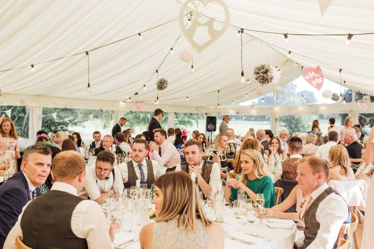 Bright outdoors wedding with seating arrangements